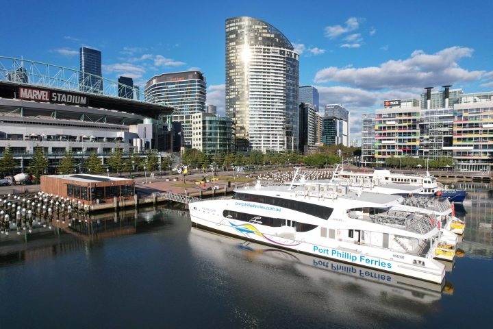 a large body of water with a city in the background