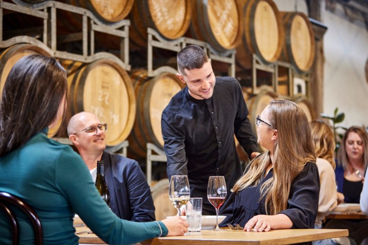 a group of people sitting at a table